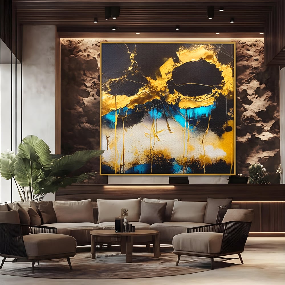 Tablou canvas cu pictura abstracta cu forme aurii si albastre, in rama de aluminiu auriu, pe perete intr-un birou